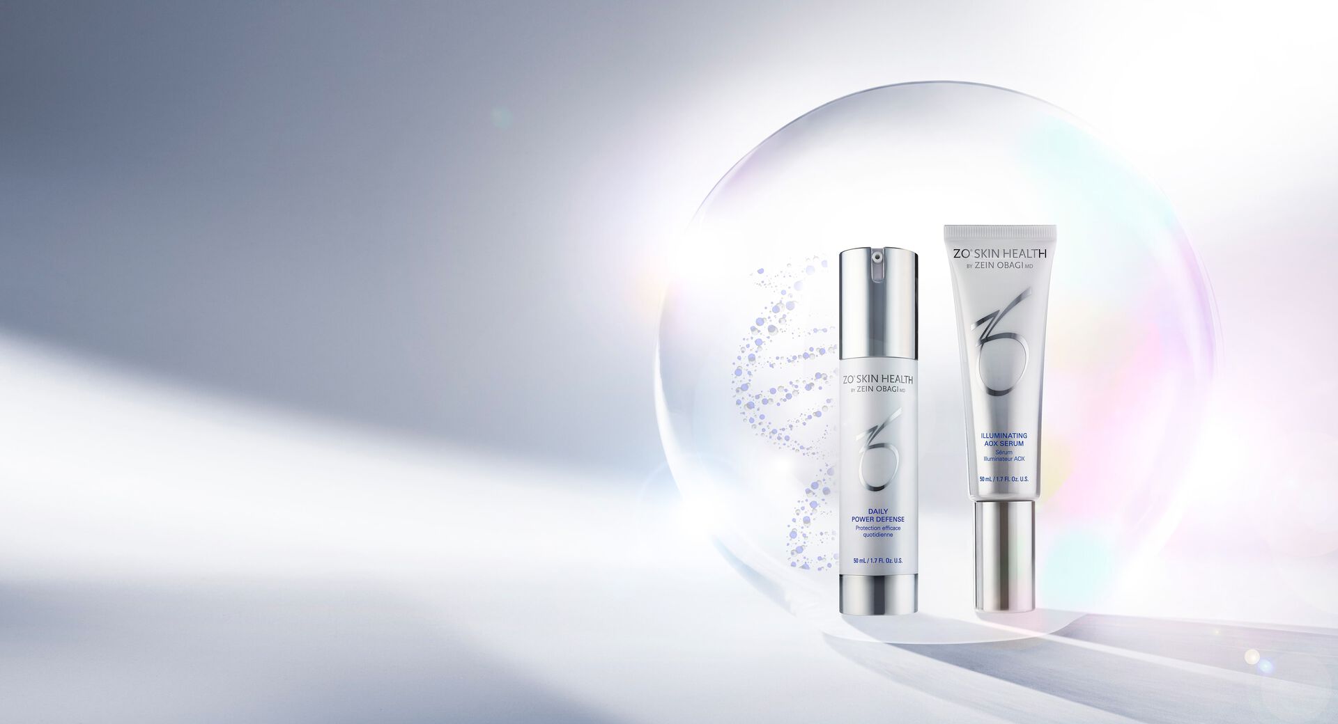 Daily Power Defense and Illuminating AOX Serum against an irridescent bubble