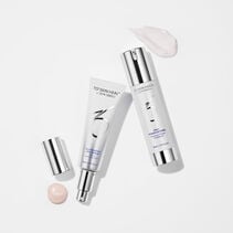 Illuminating AOX Serum and Daily Power Defense on white background